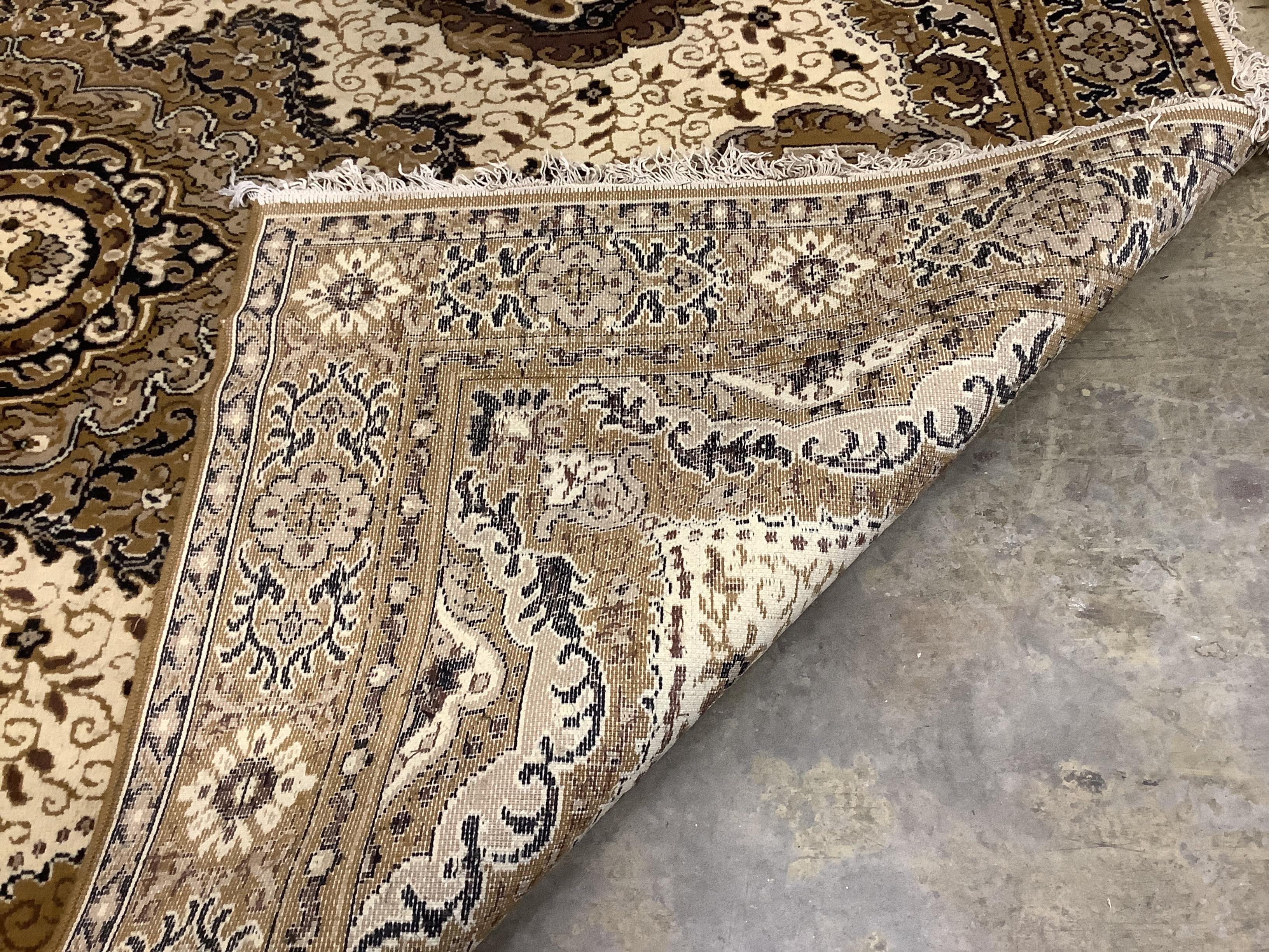 A machined Persian style ivory ground carpet, 330cm x 250cm
